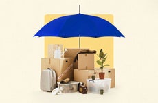 A bunch of boxes and personal possessions with an umbrella over them (blue) symbolizing the theme of this article being about coverage for contents.
