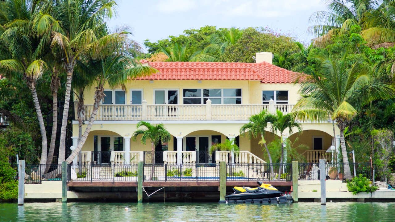 A Mediterranean-style house along the water in Miami Beach, FL.