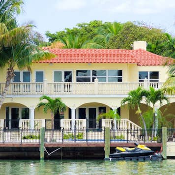 A Mediterranean-style house along the water in Miami Beach, FL.