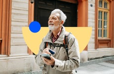 design element including an older man solo backpacking with a phone and card in his hands