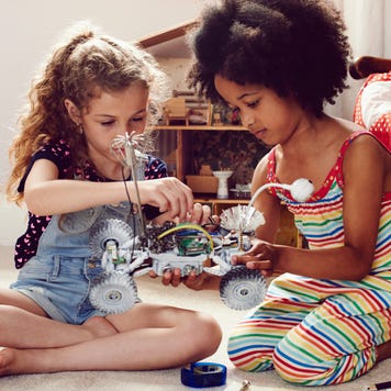 Two children working together to make things