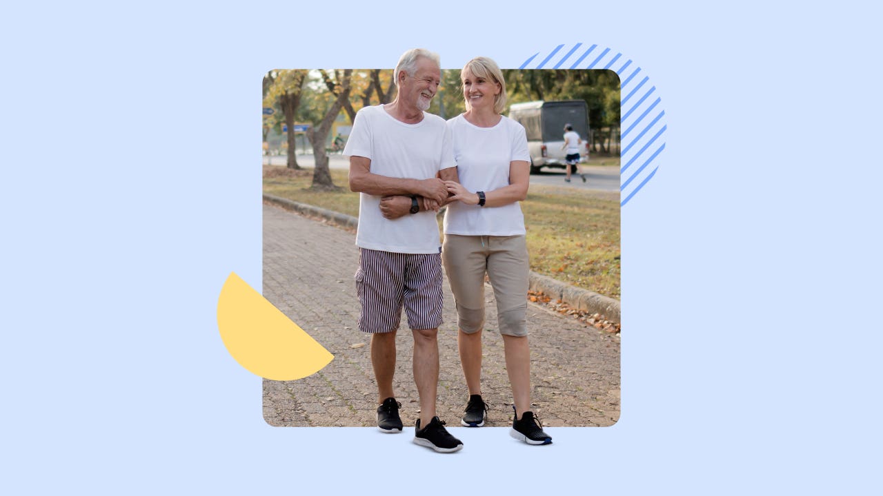 Older couple enjoying a walk together on a nice, Fall day