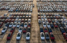 Aerial view new cars lined up in the port for import and export