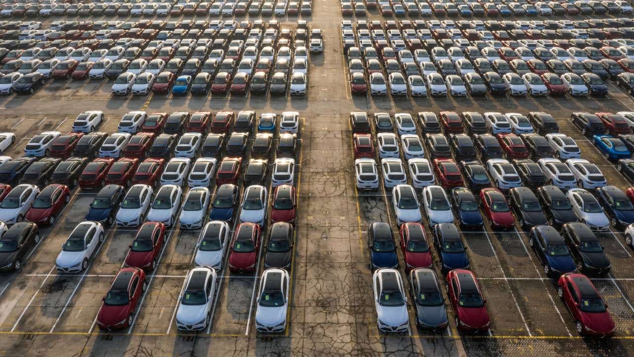 Aerial view new cars lined up in the port for import and export