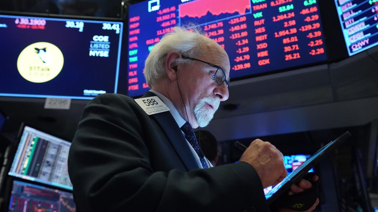 Traders work on the floor of the New York Stock Exchange