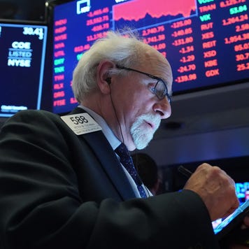 Traders work on the floor of the New York Stock Exchange