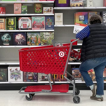 A woman shopping for a board game at Target
