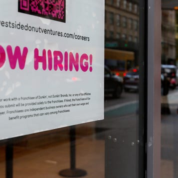 Now hiring sign in a shop window