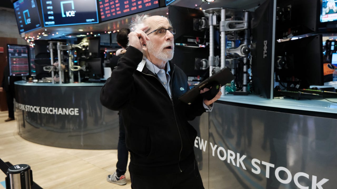 A trader stands on the New York Stock Exchange floor