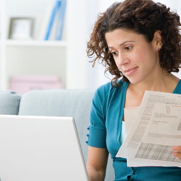 Woman paying bills online