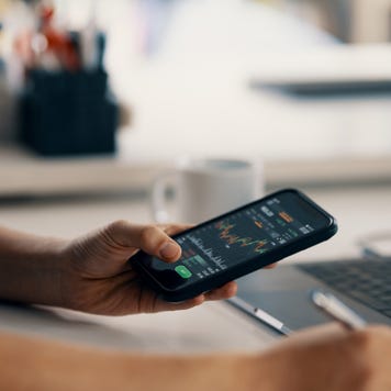 man checking financial information on a smart phone