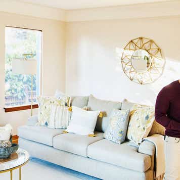 Medium wide shot of man looking at sales sheet in home