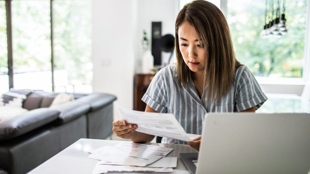 Woman paying bills at home