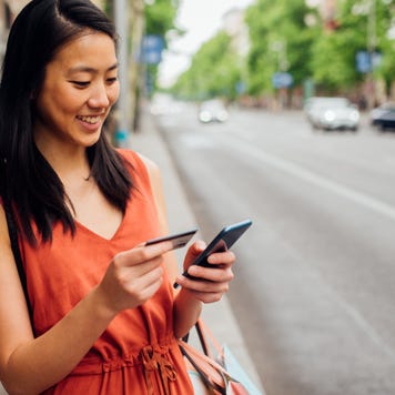 Girl shopping online on the street