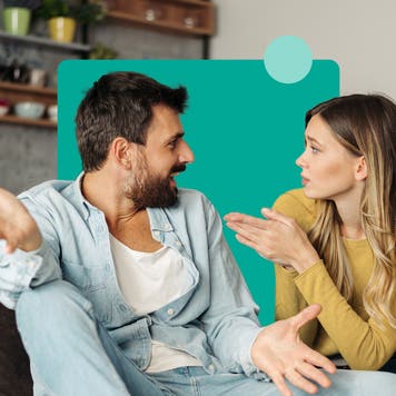 a caucasian couple sitting on the couch and having a conversation