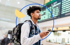 design element a man holding his cellphone inside an airport with a circle outline around him