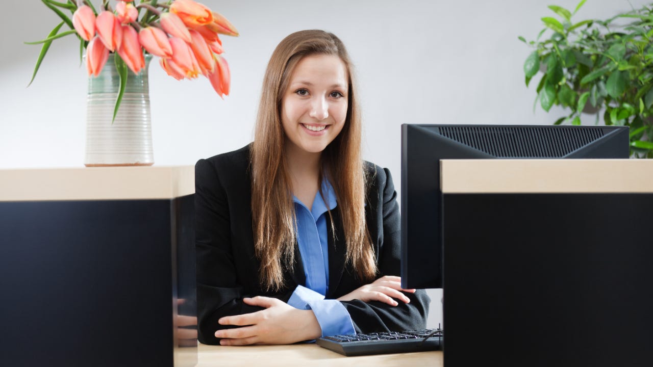 Female bank worker behind desk