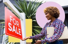 companies that buy houses for cash - real estate agent putting up for sale sign