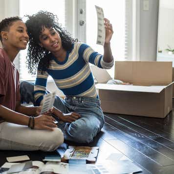 Lesbian couple picking paint colors for new home
