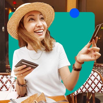 Woman holding out credit card