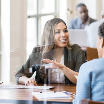 Banker discusses banking services to new customer
