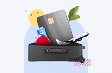 design element of an off white background and a an open suitcase with credit cards and an airplane coming out of it