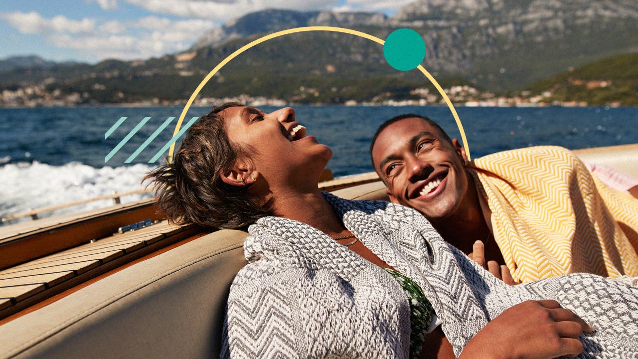 Illustration of a happy couple on the back of a boat.