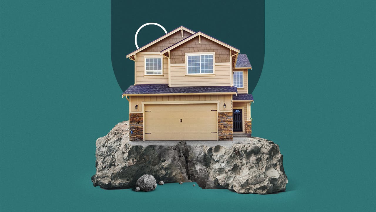 photo illustration of house on edge of cliff with blue-green background