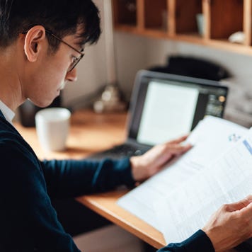 Serious man looking at paperwork