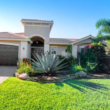 The outside of a large suburban home in Southern Florida