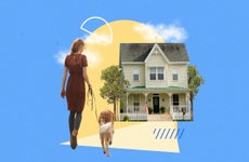 Woman walking her dog toward a house