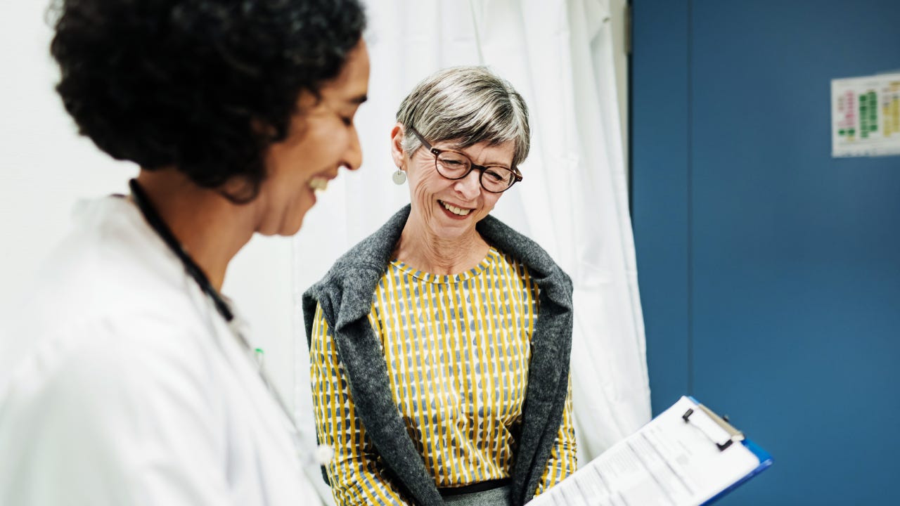 Doctor Going Over Test Results With Patient