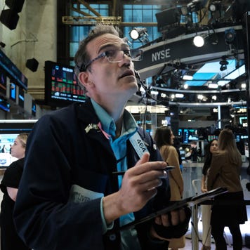 Traders work on the floor of the New York Stock Exchange