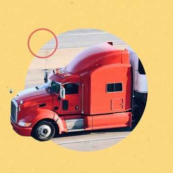 A truck is driving on the road.