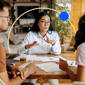 Two people meeting with an agent