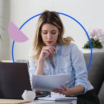 A woman reviewing documents