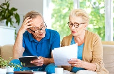 Senior couple looking at financial documents