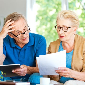 Senior couple looking at financial documents