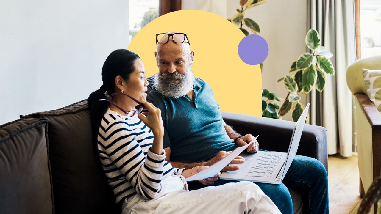 Couple discussing finances on a couch