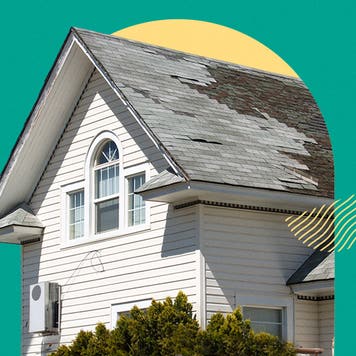 Photo of a house with old roofing tiles that need to be replaced.