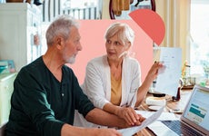 Older couple talking to each other about financial documents