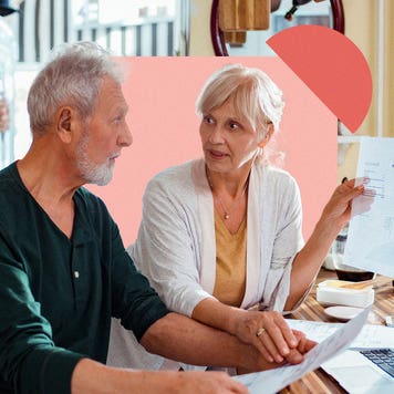 Older couple talking to each other about financial documents