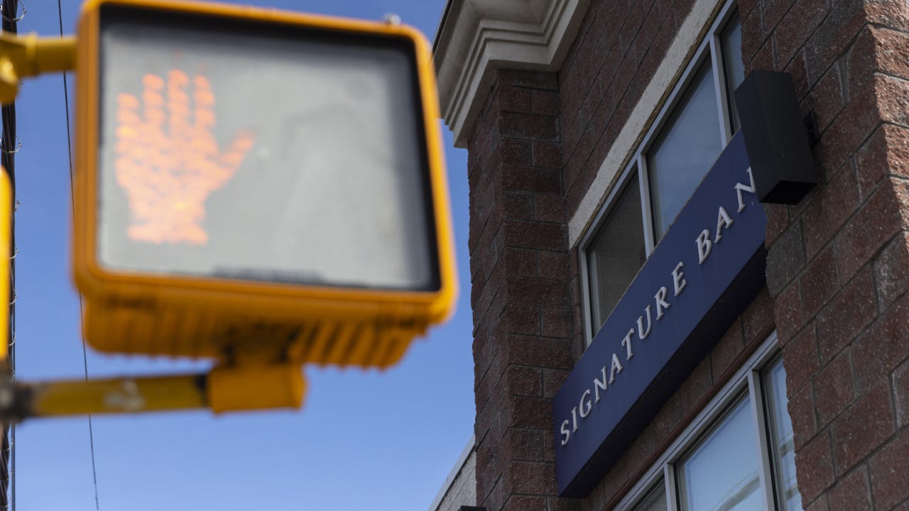 Signage outside a Signature Bank branch in the Brooklyn borough of New York