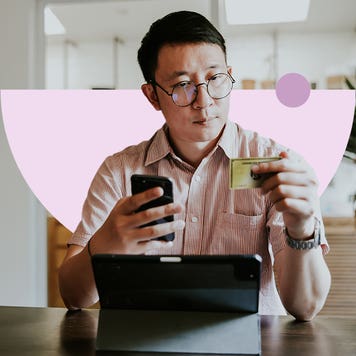 design element of a man looking at a card in his hand while holding a phone in the other hand