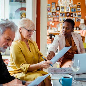 Financial advisor talking to clients