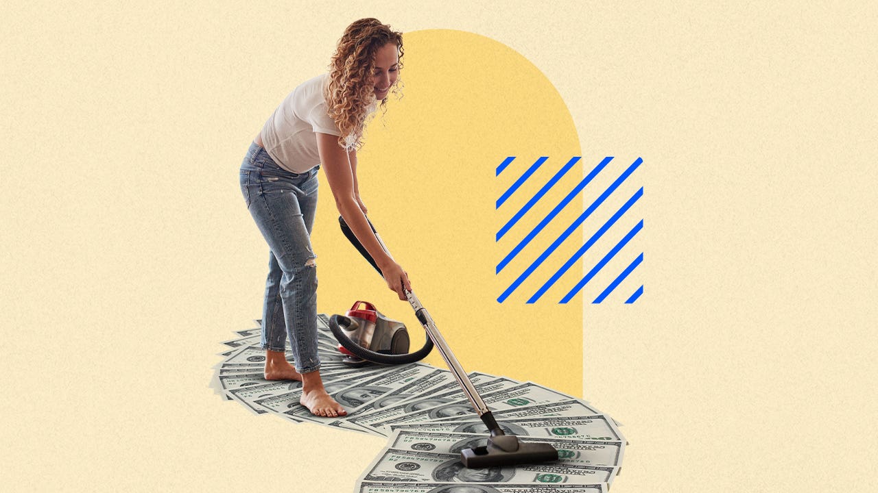 Woman vacuuming money
