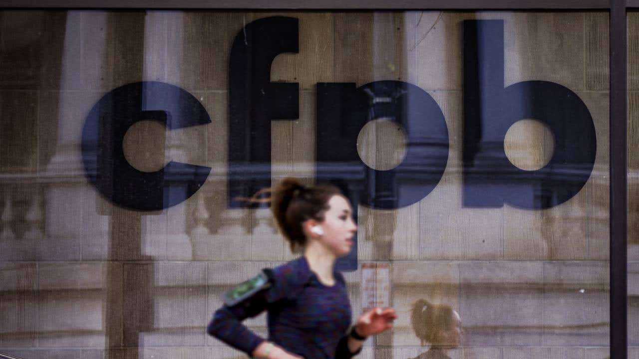 A jogger runs past CFPB building