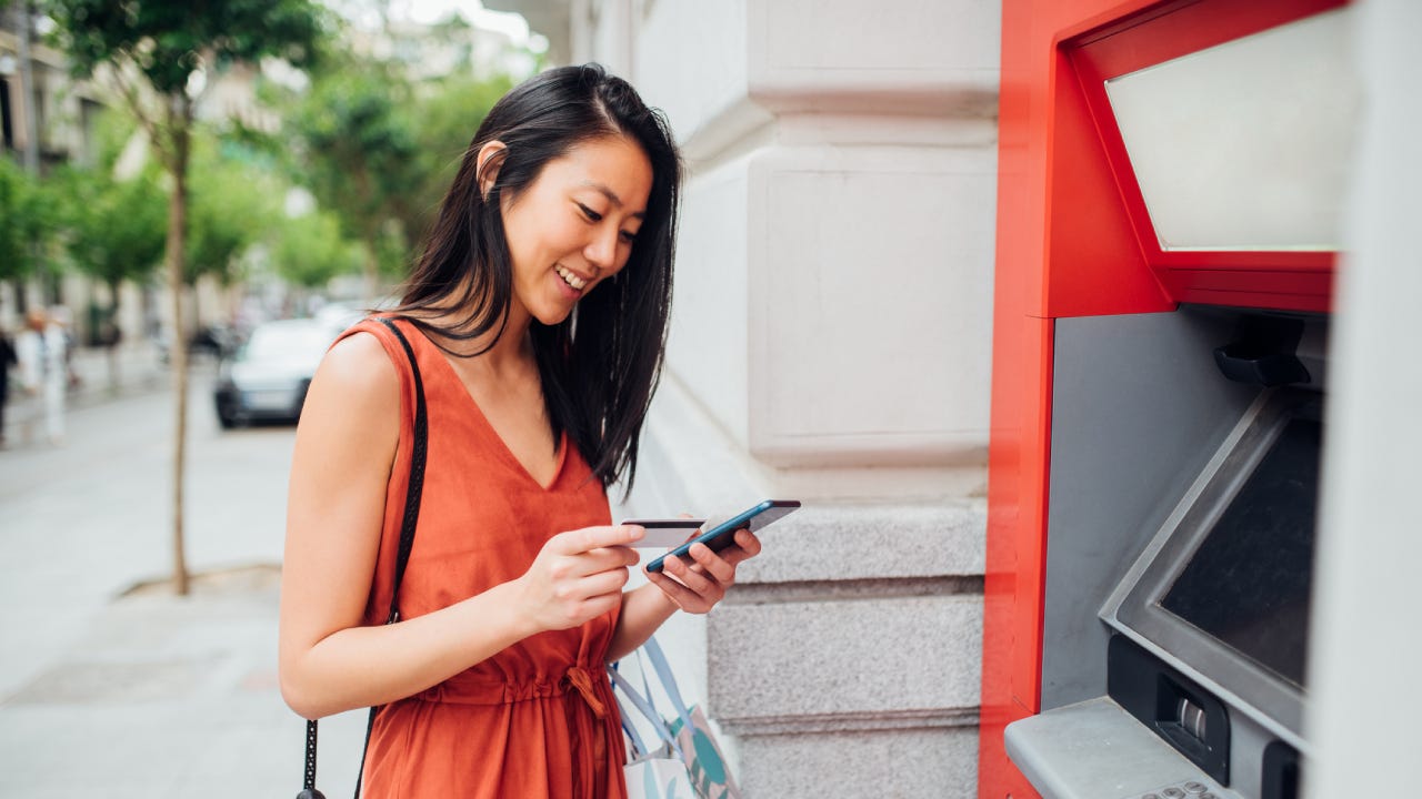 Young woman using an ATM