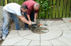 Two men laying down patio