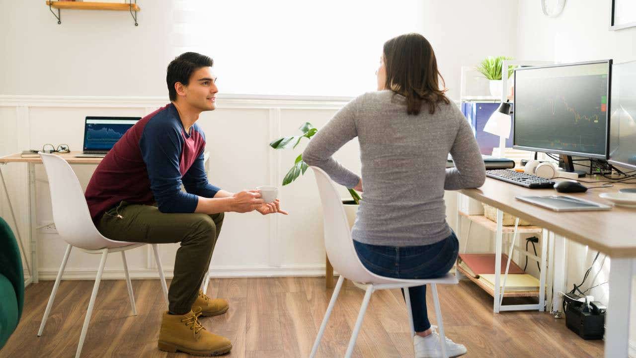 Generation z couple talking while working together